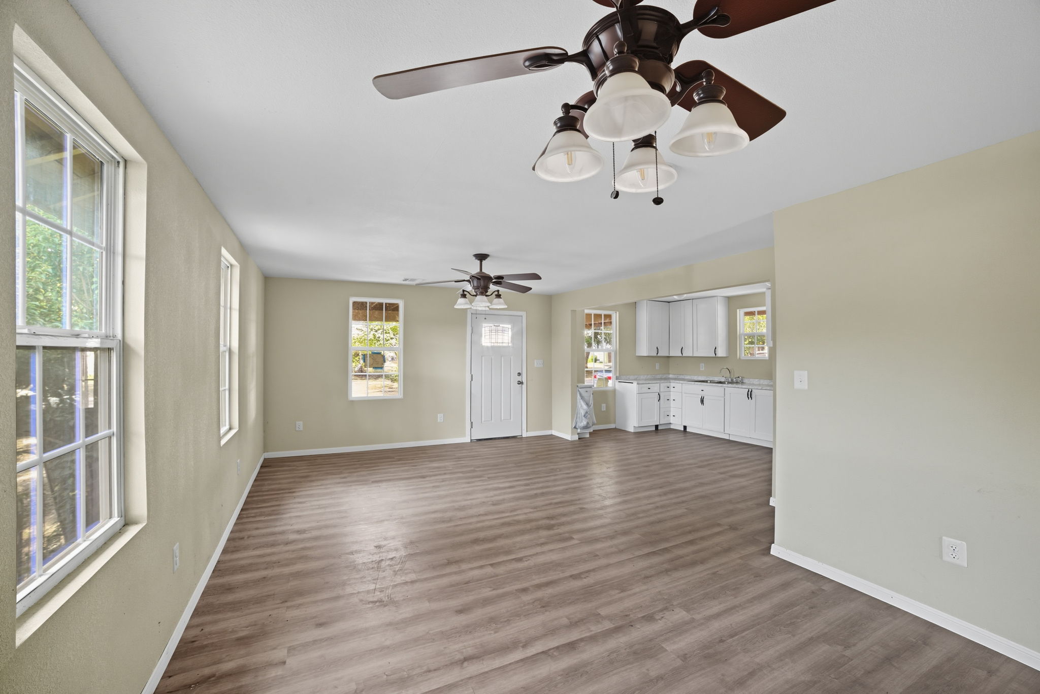 1413 South 2nd Street Temple, TX 76504 - Photo 11 of 24 wooden floor in an empty room with a window