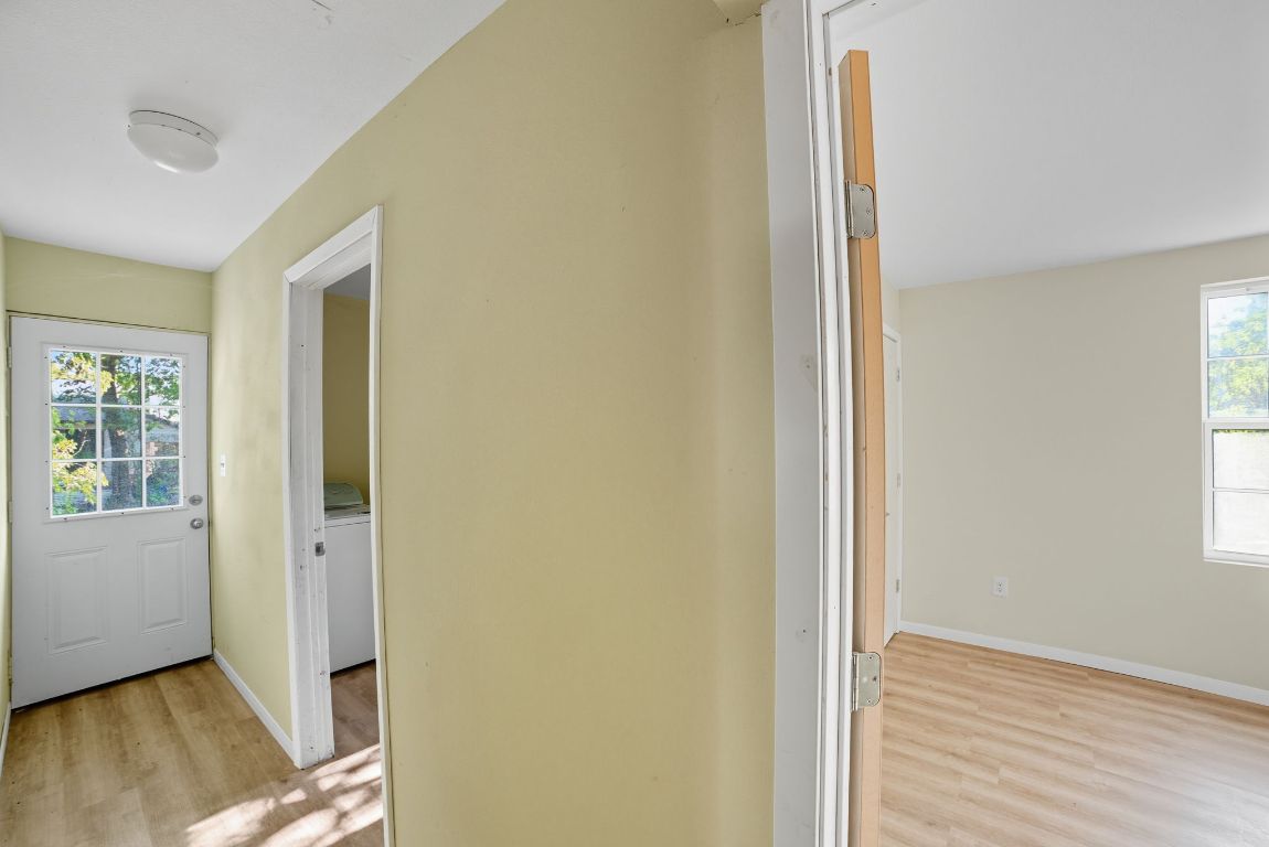 1413 South 2nd Street Temple, TX 76504 - Photo 17 of 24 Hall featuring healthy amount of natural light, light wood-style flooring, and washer / dryer