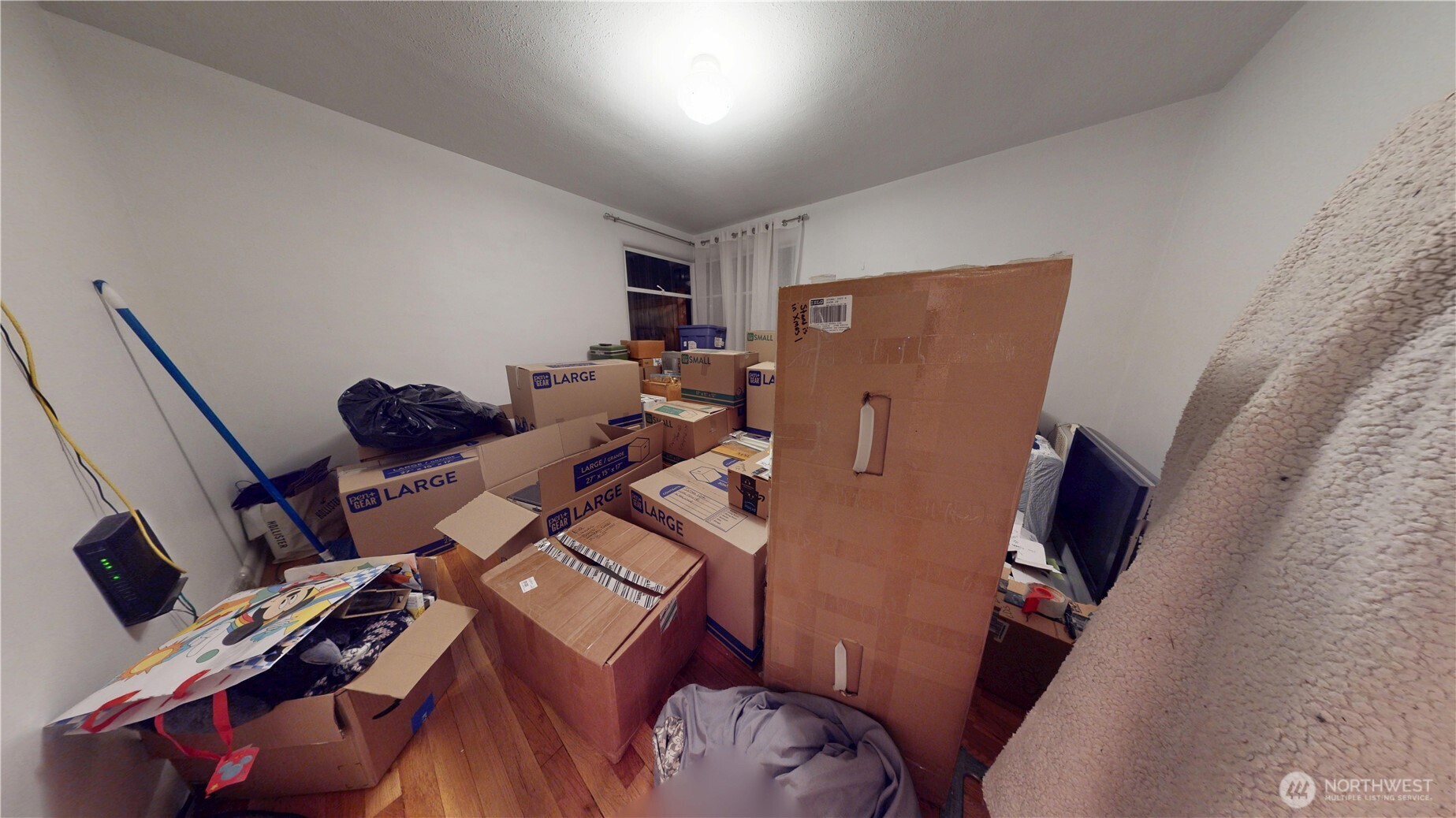 16835 113th Avenue Southeast Renton, WA 98055 - Photo 13 of 34 a living room with furniture and a flat screen tv