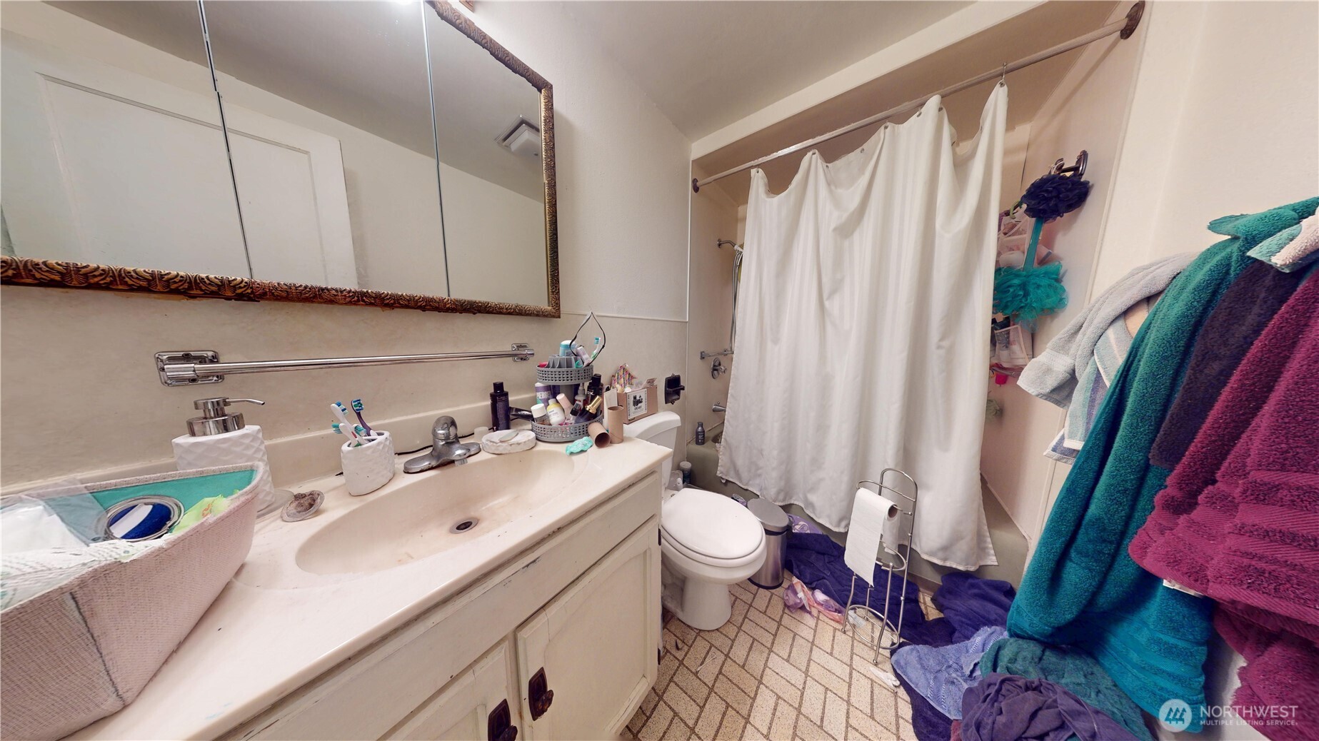 16835 113th Avenue Southeast Renton, WA 98055 - Photo 14 of 34 a bathroom with a sink toilet and shower