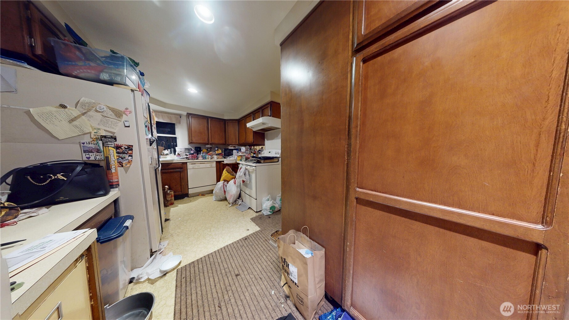 16835 113th Avenue Southeast Renton, WA 98055 - Photo 20 of 34 a kitchen with stainless steel appliances a refrigerator and a stove