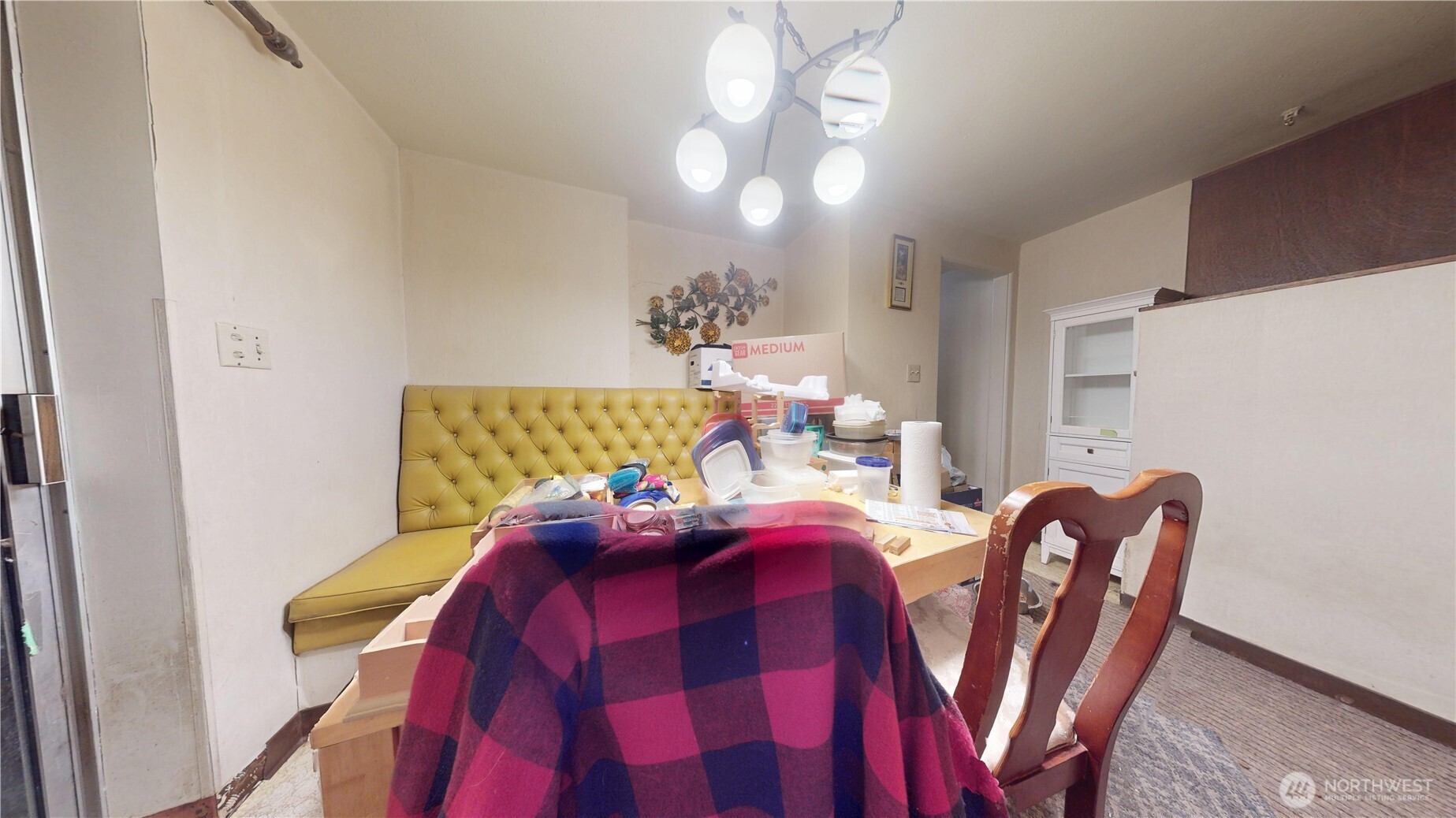 16835 113th Avenue Southeast Renton, WA 98055 - Photo 23 of 34 a view of a dining room with furniture and chandelier
