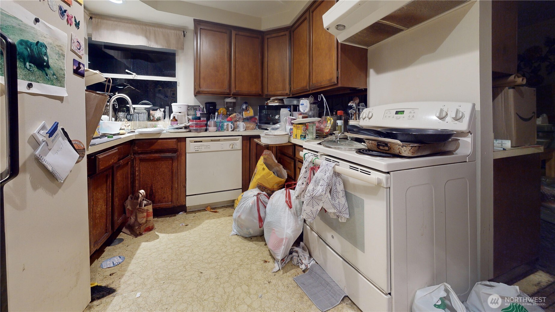 16835 113th Avenue Southeast Renton, WA 98055 - Photo 31 of 34 a kitchen with a sink appliances and cabinets