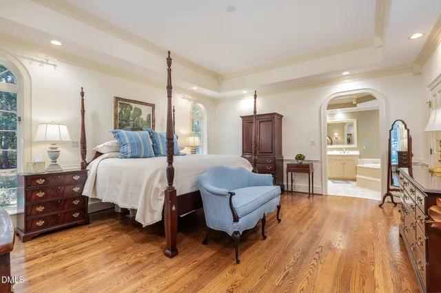 a bed room with furniture and a wooden floor