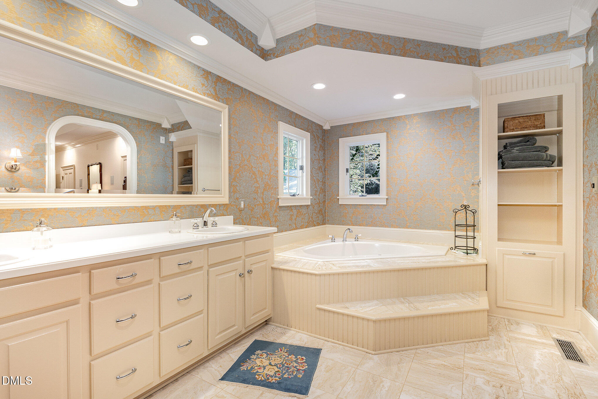 672 Lake Wackena Road Goldsboro, NC 27534 - Photo 16 of 46 a spacious bathroom with a tub sink and mirror