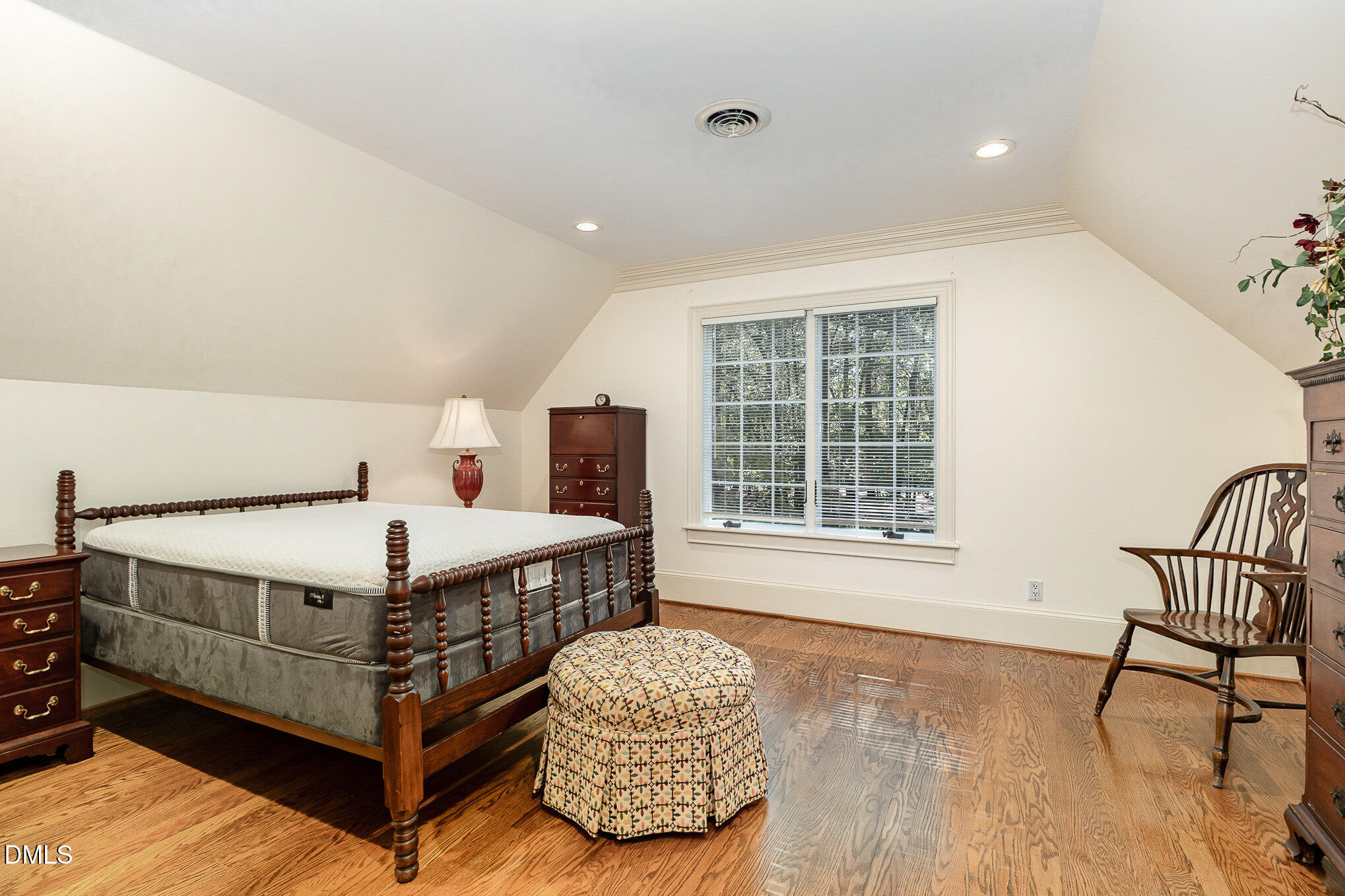 672 Lake Wackena Road Goldsboro, NC 27534 - Photo 21 of 46 a bedroom with a bed and a chair