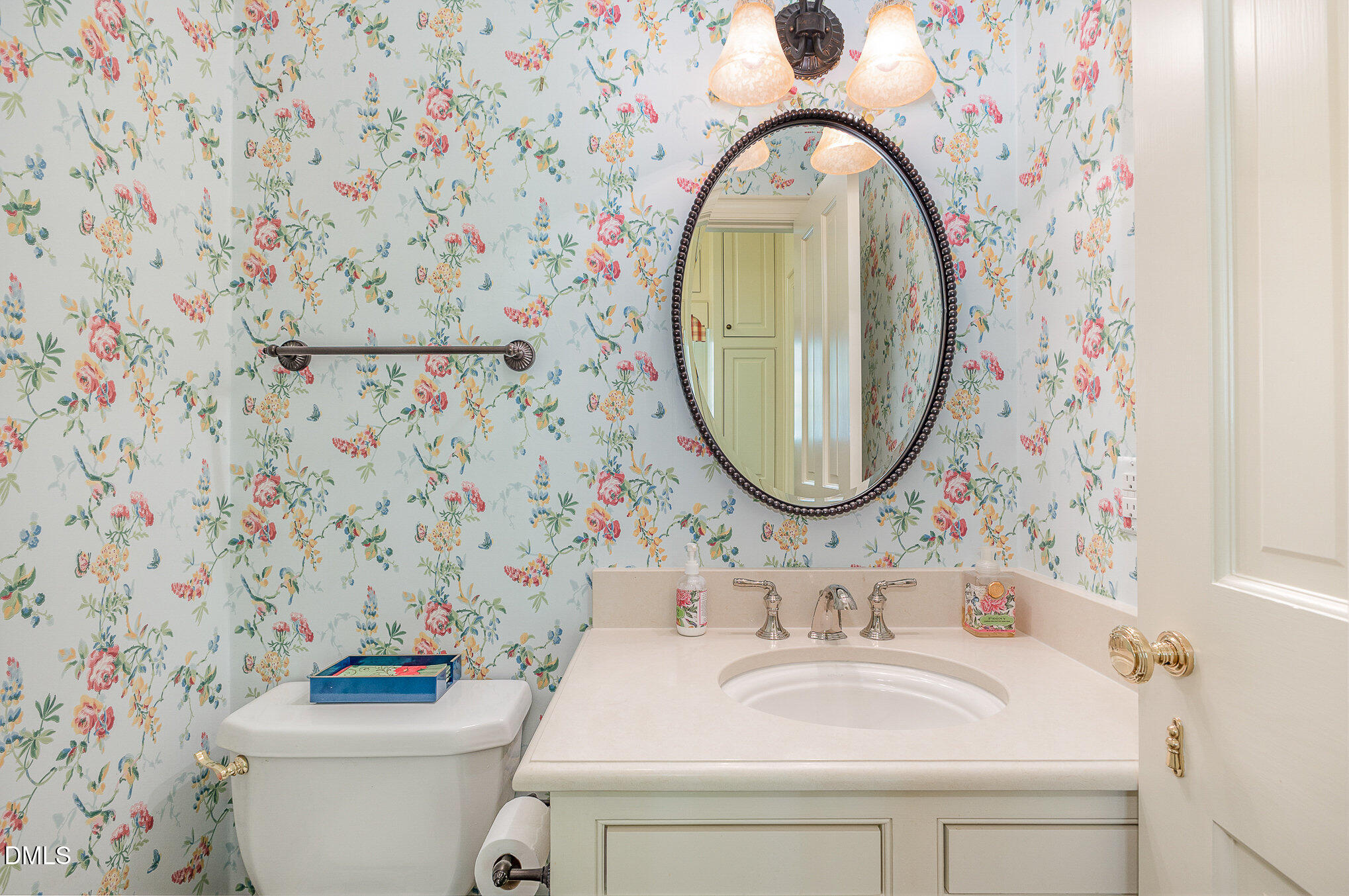 672 Lake Wackena Road Goldsboro, NC 27534 - Photo 24 of 46 a bathroom with a sink mirror and toilet