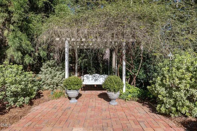 a view of a backyard with sitting area