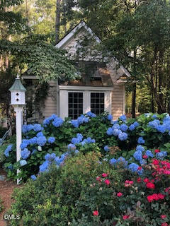 672 Lake Wackena Road Goldsboro, NC 27534 - Photo 43 of 46 a front view of a house with a yard and fountain