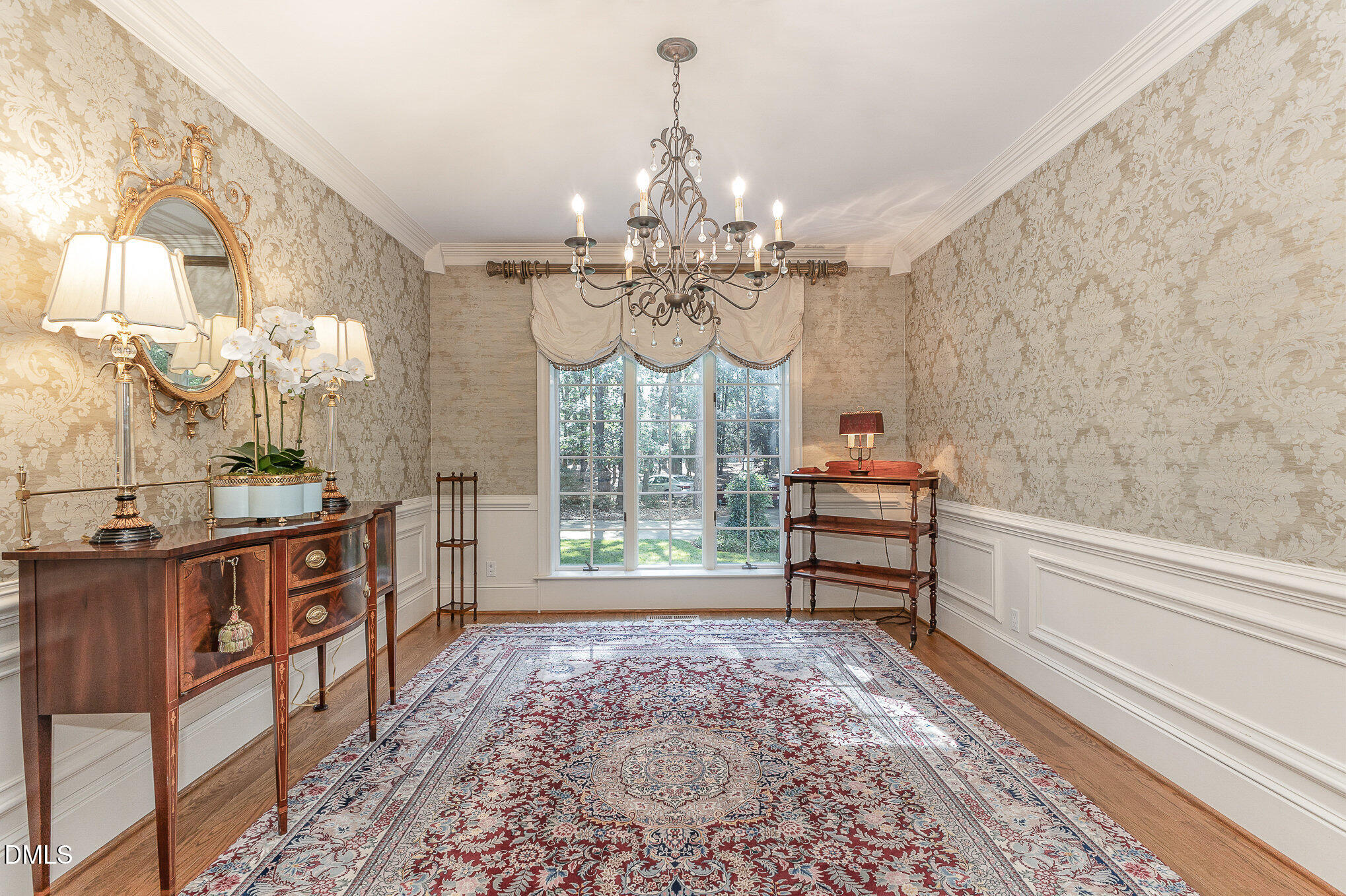 672 Lake Wackena Road Goldsboro, NC 27534 - Photo 7 of 46 a view of a dining room with furniture a chandelier and wooden floor