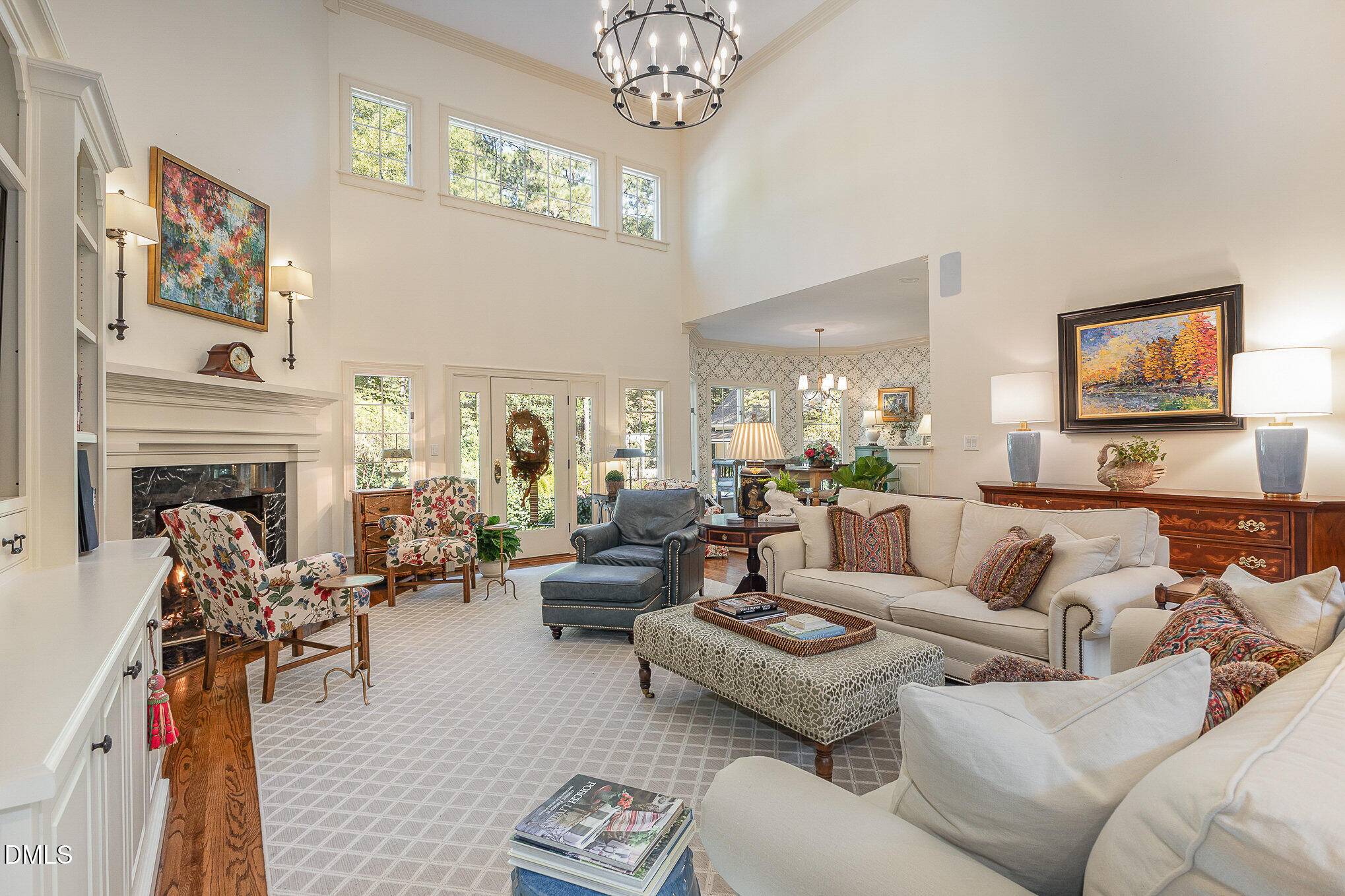 672 Lake Wackena Road Goldsboro, NC 27534 - Photo 8 of 46 a living room with furniture a chandelier and a fireplace