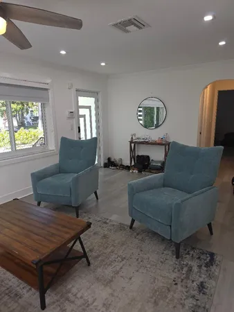 a living room with furniture and a window