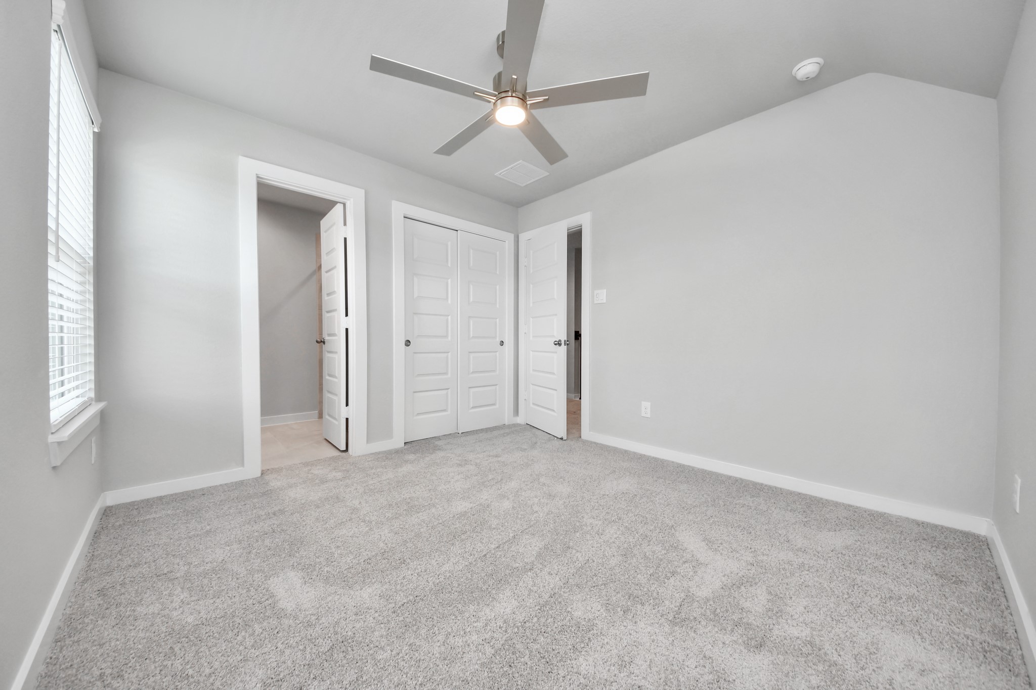 2946 Burris Park Drive Spring, TX 77373 - Photo 33 of 45 Generously sized secondary bedrooms featuring spacious closets, soft and inviting carpeting underfoot, large windows allowing plenty of natural light, and the added touch of privacy blinds for your personal retreat.