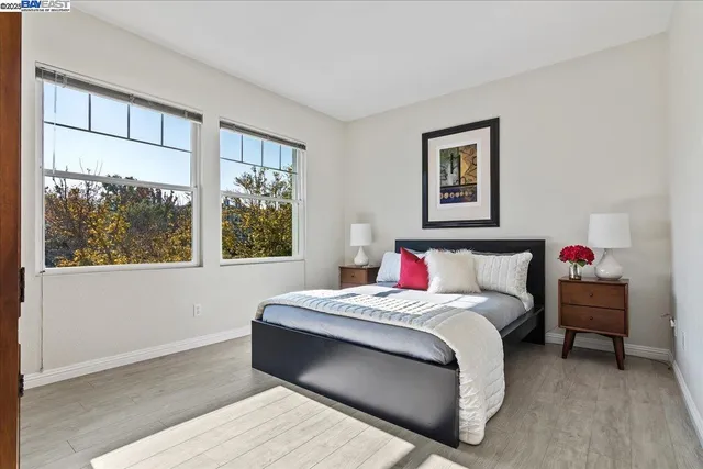 a bedroom with a large bed and a window