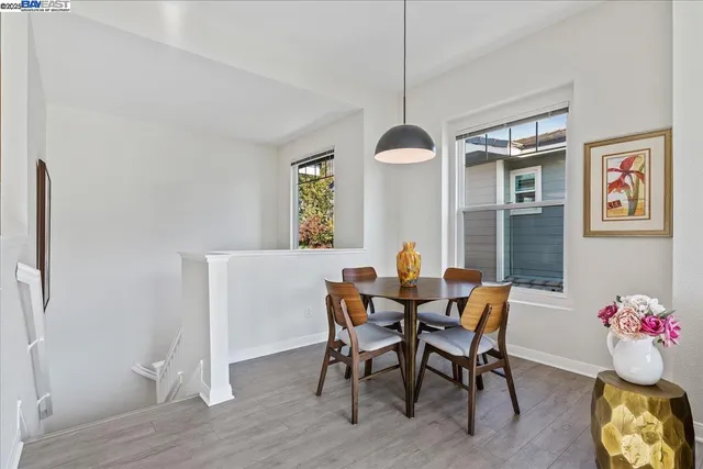 a view of a dining room with furniture and window