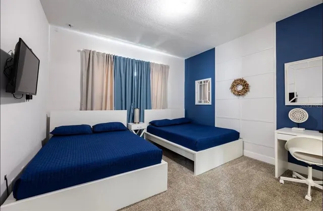 a living room with a couch and a flat screen tv