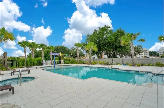 a view of a swimming pool and lounge chair