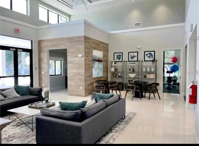 a living room with furniture and a large window