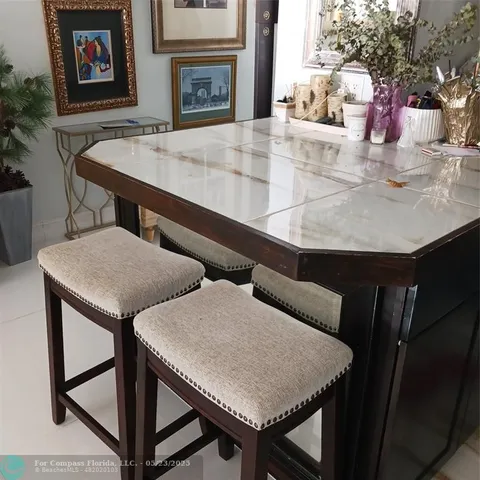 a view of a room with furniture and a fireplace