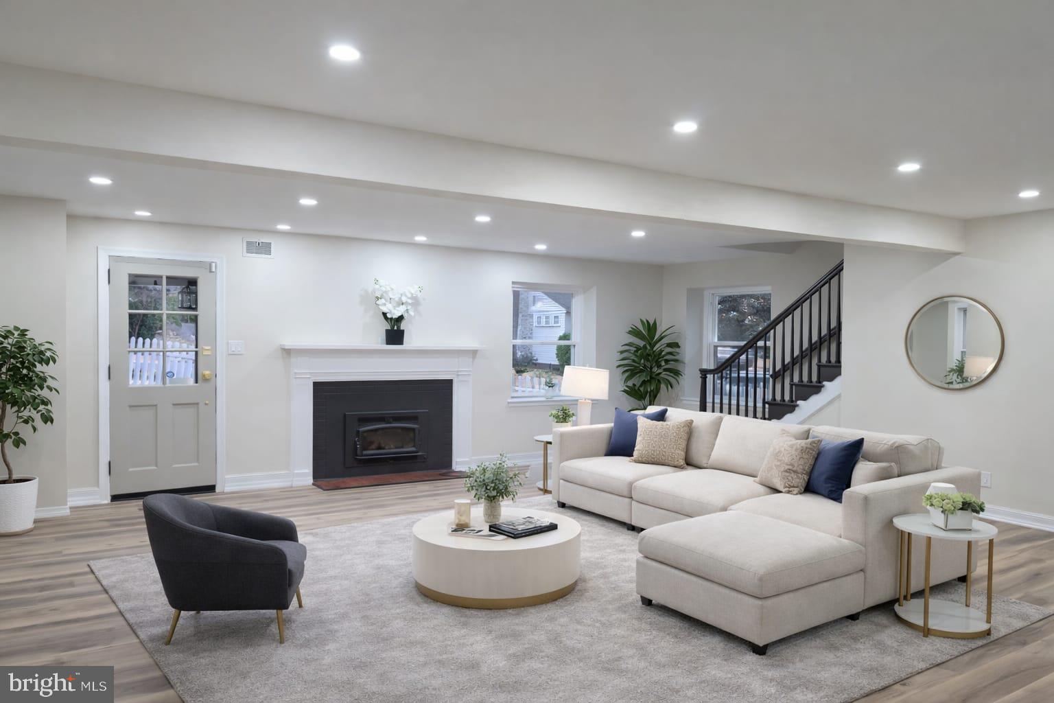 103 North 27th Street Reading, PA 19606 - Photo 3 of 15 a living room with furniture and a fireplace