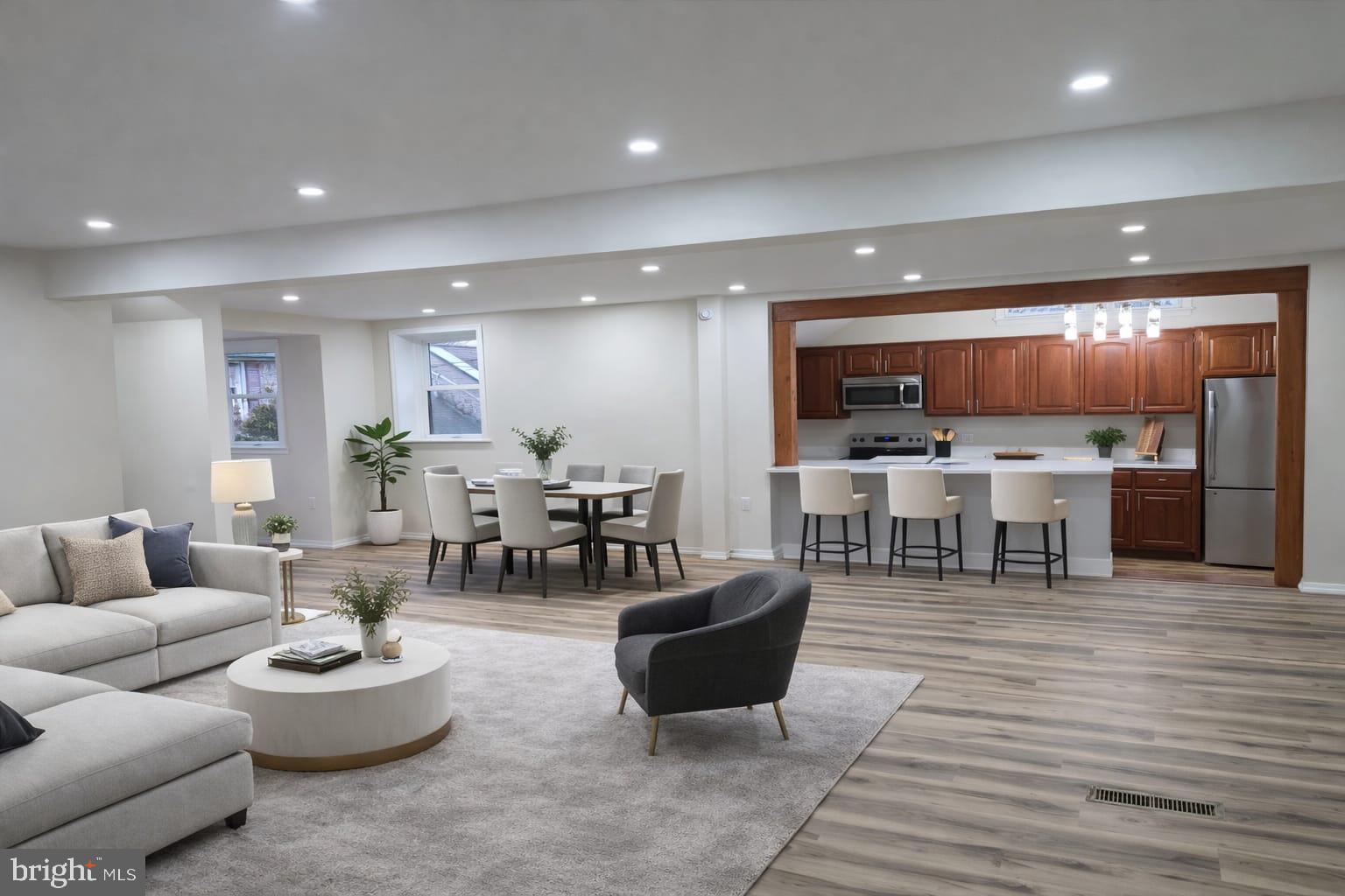 103 North 27th Street Reading, PA 19606 - Photo 4 of 15 a living room with furniture and kitchen view