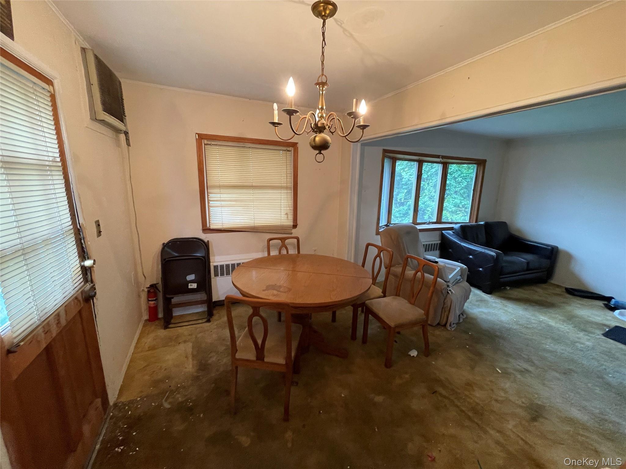 2043 Paddock Road Seaford, NY 11783 - Photo 6 of 25 a view of a livingroom with furniture and window