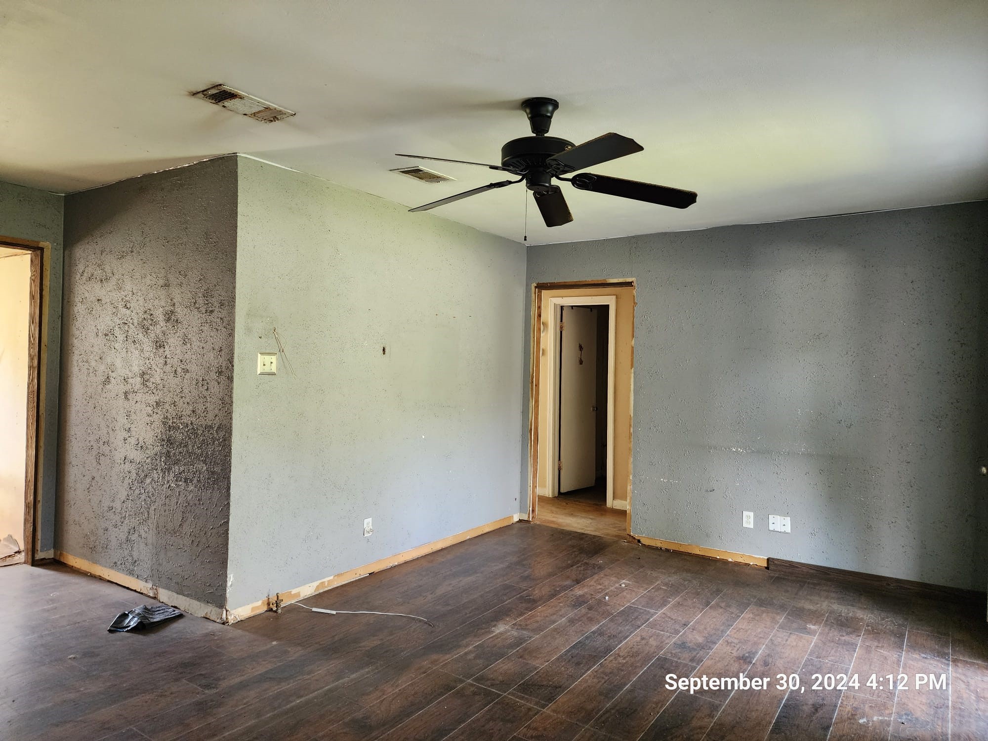11645 Loop Road Beaumont, TX 77713 - Photo 3 of 20 an empty room with wooden floor closet and windows