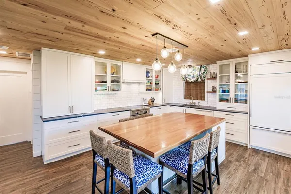 a bedroom with a bed and a table