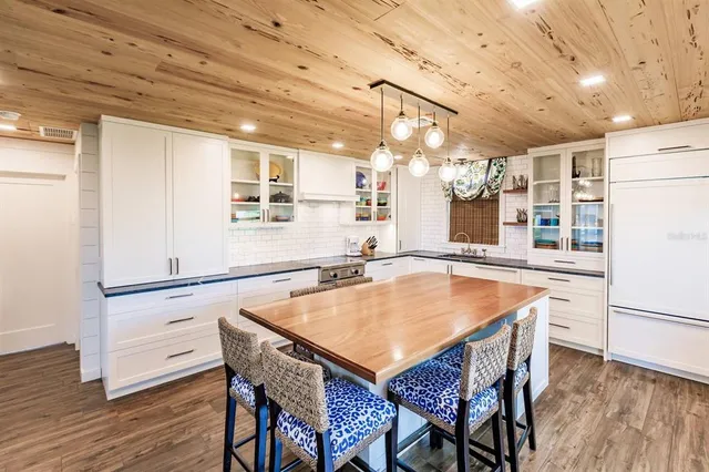 a bedroom with a bed and a table