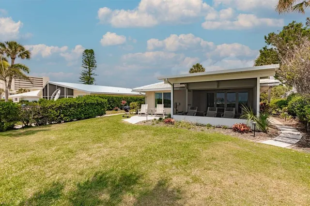 a view of a swimming pool with a bench and a fountain