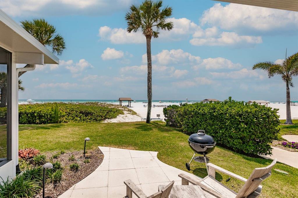 6020 Midnight Pass Road, Unit 26 Sarasota, FL 34242 - Photo 23 of 25 a view of a lake with a terrace