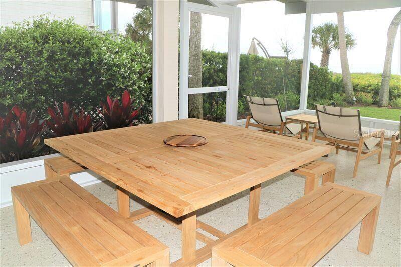 6020 Midnight Pass Road, Unit 26 Sarasota, FL 34242 - Photo 25 of 25 a view of a swimming pool with a patio