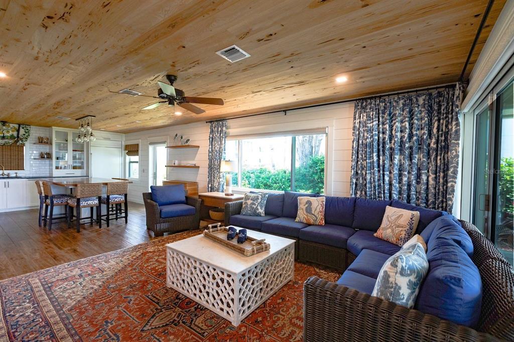 6020 Midnight Pass Road, Unit 26 Sarasota, FL 34242 - Photo 8 of 25 a living room with furniture and a large window