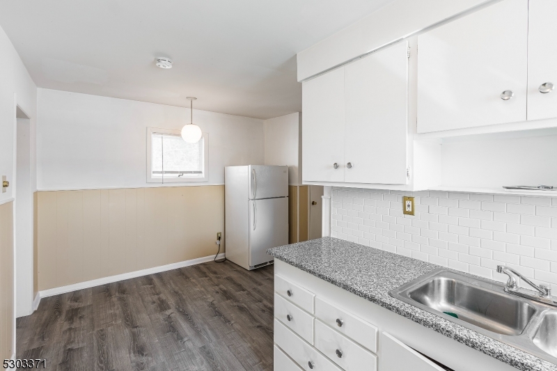 26 Schooleys Mountain Road Long Valley, NJ 07853 - Photo 3 of 10 a kitchen with granite countertop a sink a refrigerator and window