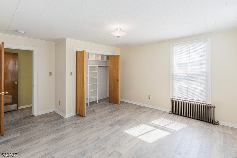 26 Schooleys Mountain Road Long Valley, NJ 07853 - Photo 9 of 10 an empty room with wooden floor and windows