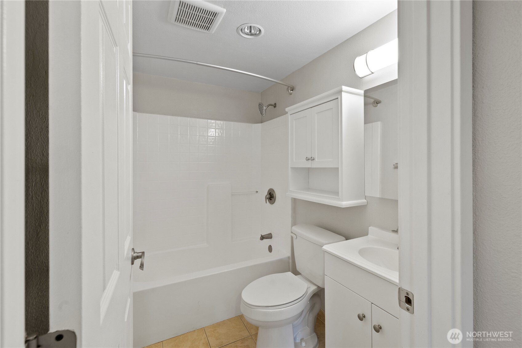4811 South 252nd Place Kent, WA 98032 - Photo 5 of 6 a bathroom with a granite countertop sink a toilet and shower