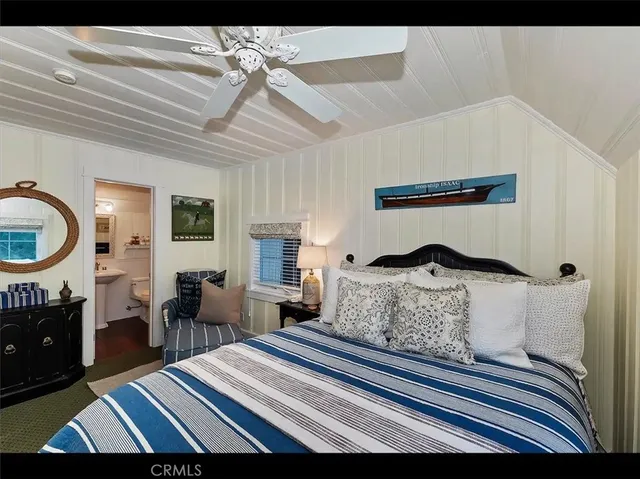 a bedroom with furniture and a fireplace