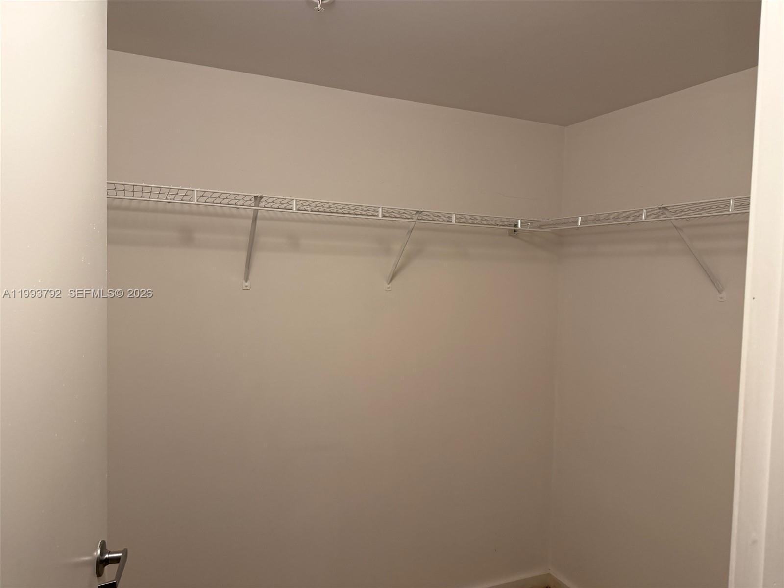 9055 Southwest 73rd Court, Unit 2002 Miami, FL 33156 - Photo 4 of 6 a close view of closet