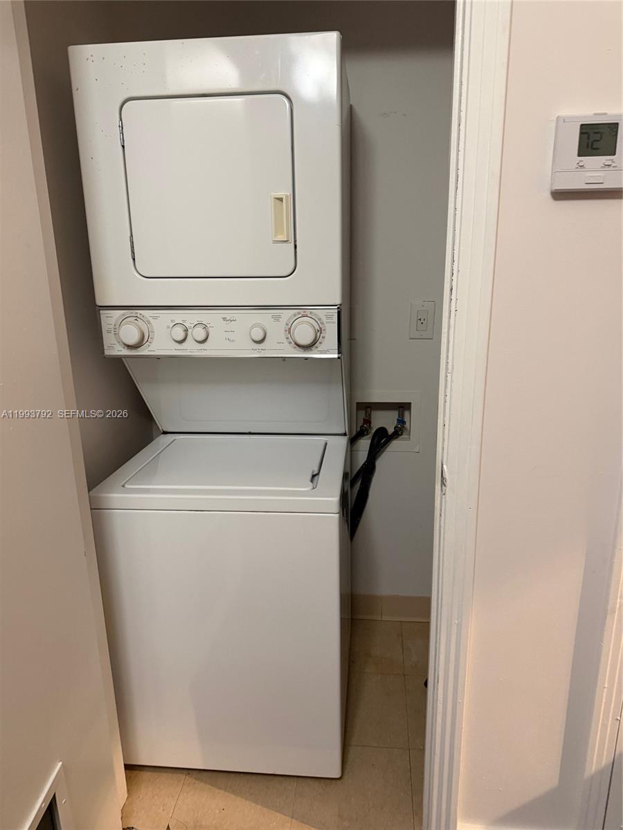 9055 Southwest 73rd Court, Unit 2002 Miami, FL 33156 - Photo 6 of 6 a utility room with dryer and washer