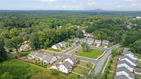 an aerial view of a house with a garden