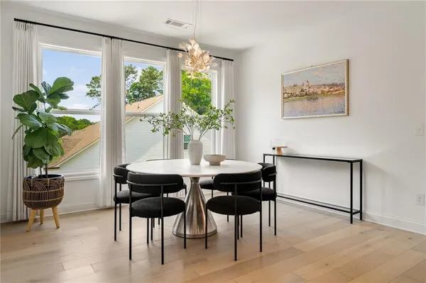 a dining room with furniture and window