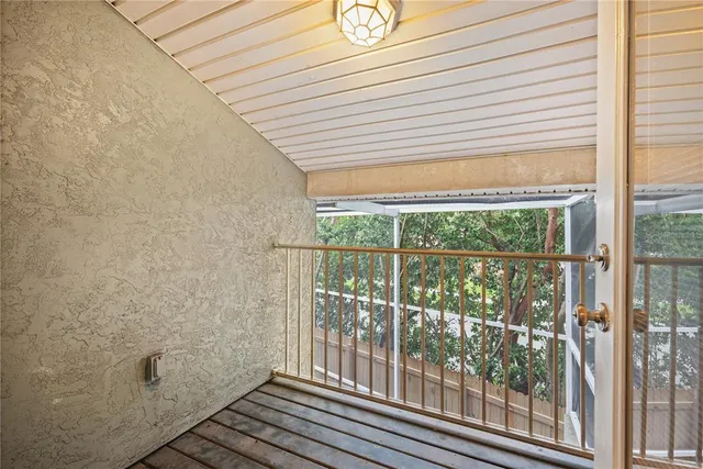 a spacious bathroom with a granite countertop sink a mirror and a shower