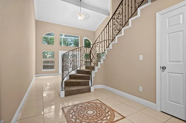 a view of entryway and hall with a front door