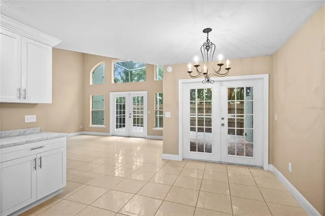 a bathroom with a granite countertop sink with a mirror