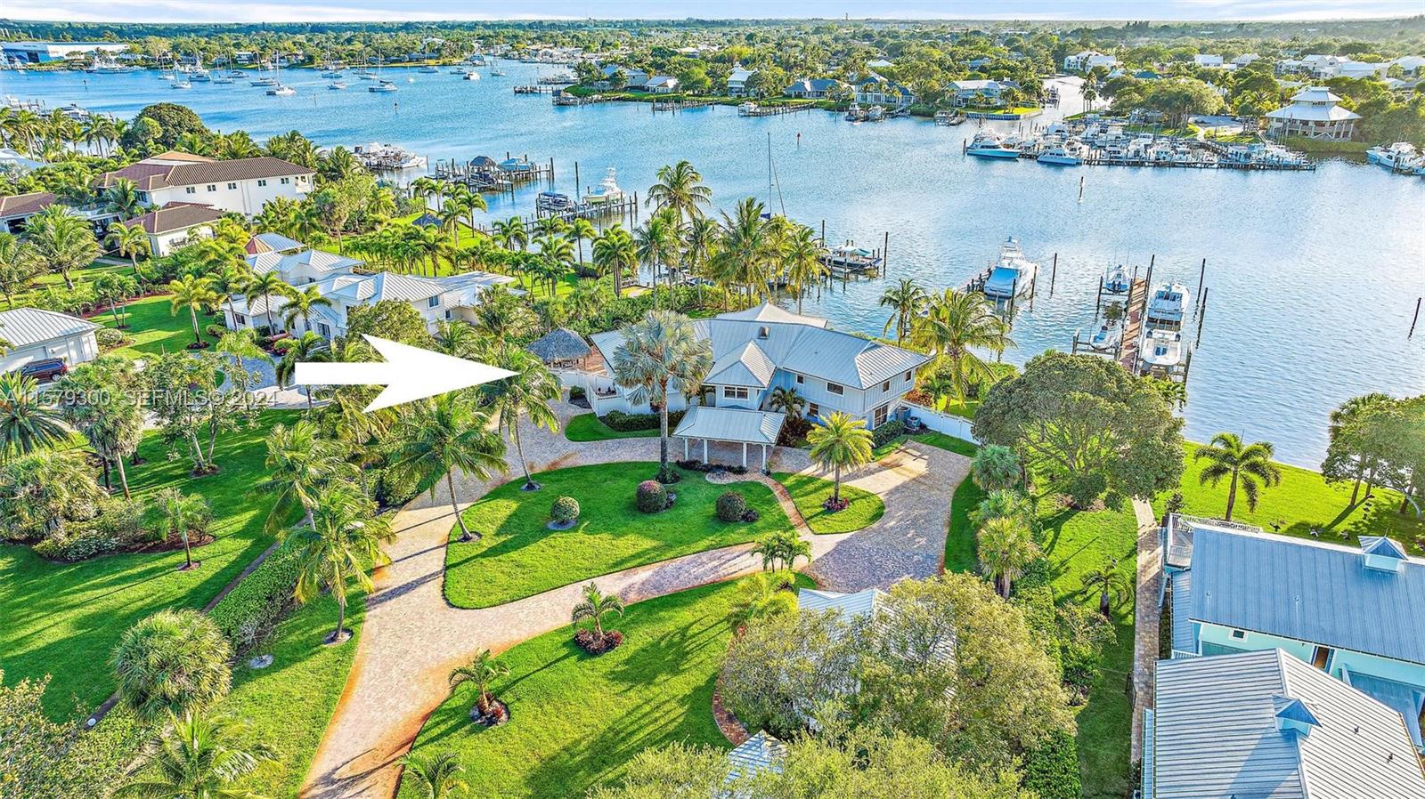 4643 Cheerio Way Stuart, FL 34997 - Photo 20 of 69 an aerial view of a houses with a lake view