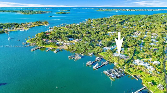 a bathroom with a tub shower and sink
