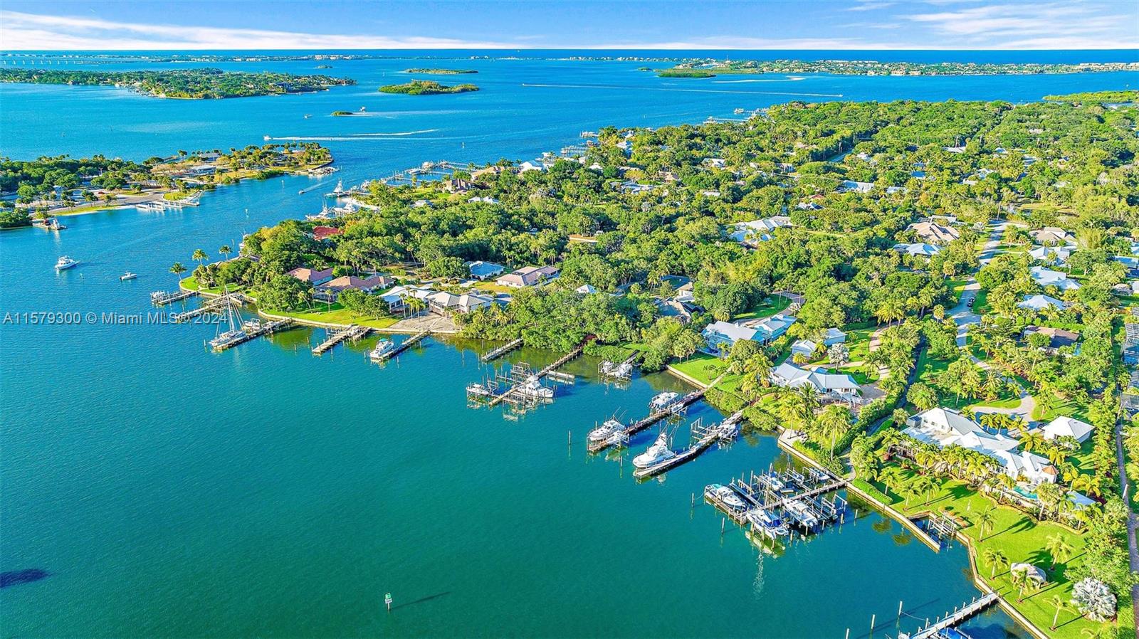 4643 Cheerio Way Stuart, FL 34997 - Photo 30 of 69 a view of a lake with a big yard