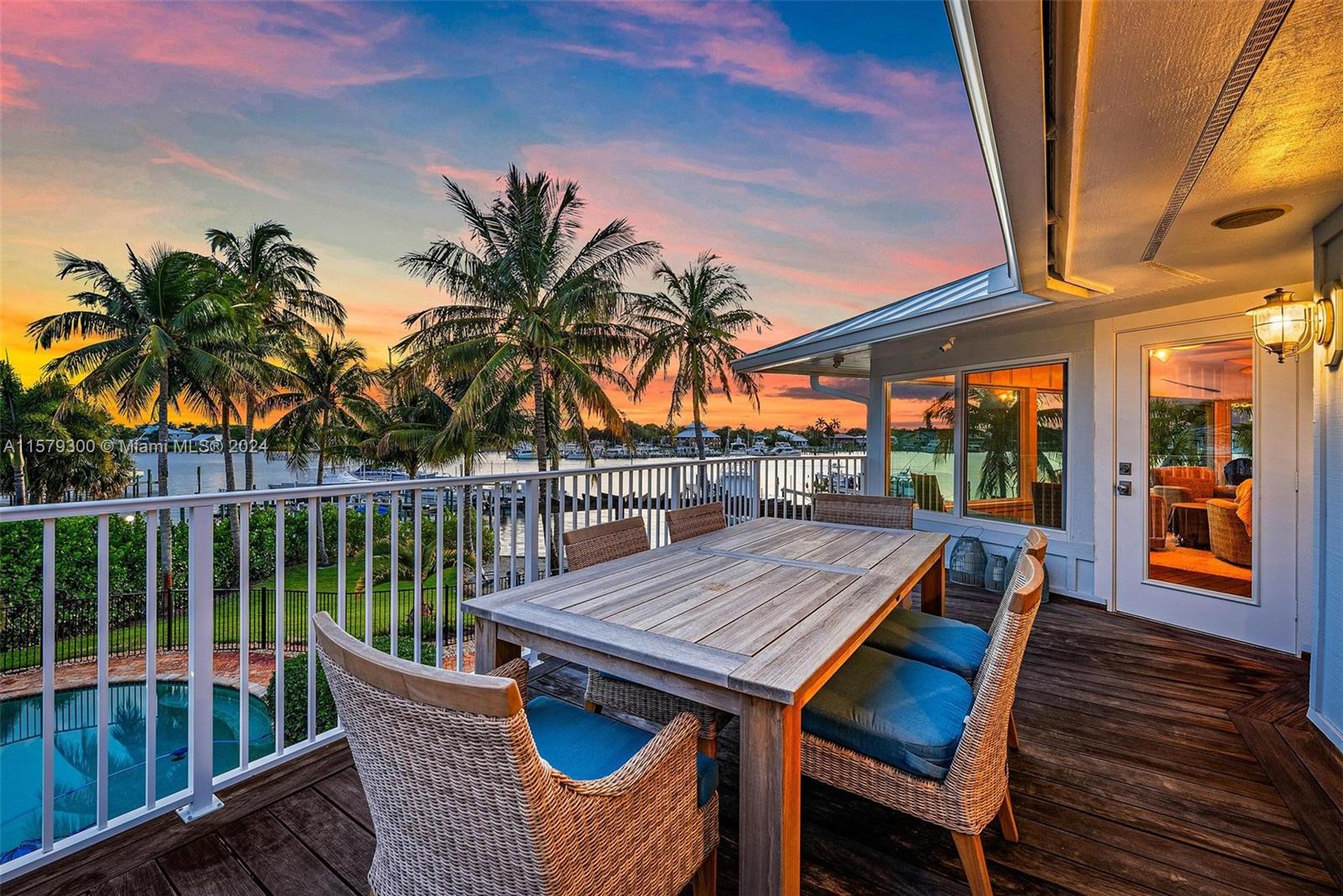 4643 Cheerio Way Stuart, FL 34997 - Photo 33 of 69 a view of a patio with a table chairs and a potted plant