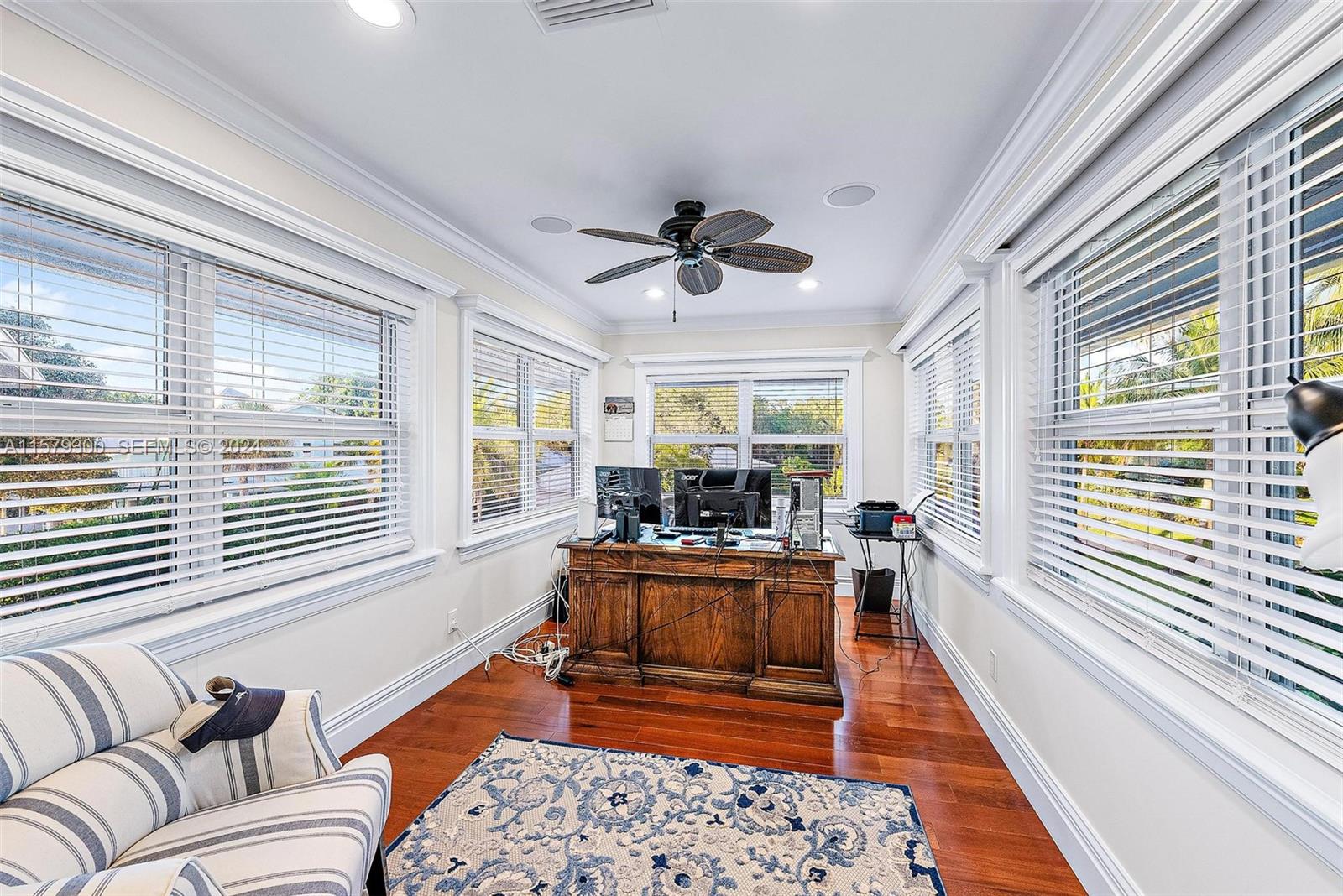 4643 Cheerio Way Stuart, FL 34997 - Photo 36 of 69 a living room with furniture and a large window