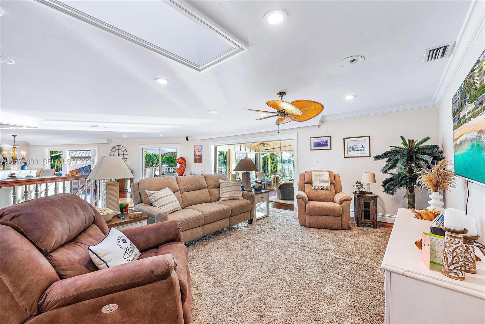4643 Cheerio Way Stuart, FL 34997 - Photo 37 of 69 a living room with furniture and a flat screen tv